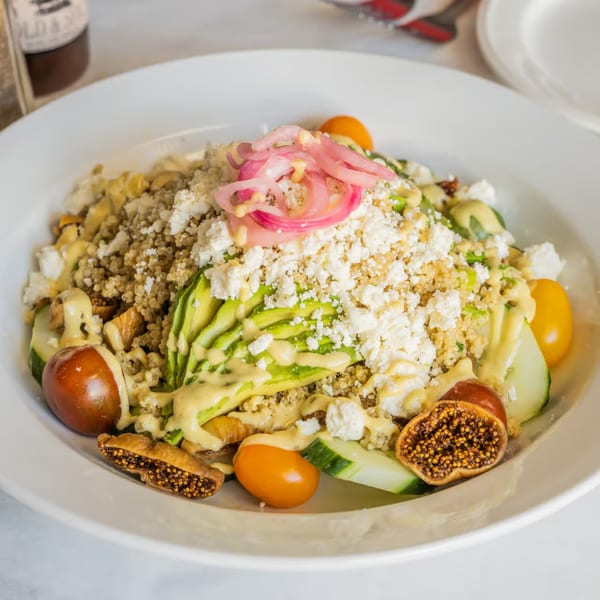 Austin's Ale House quinoa salad with avocado, feta, figs, tomatoes, and pickled onions.